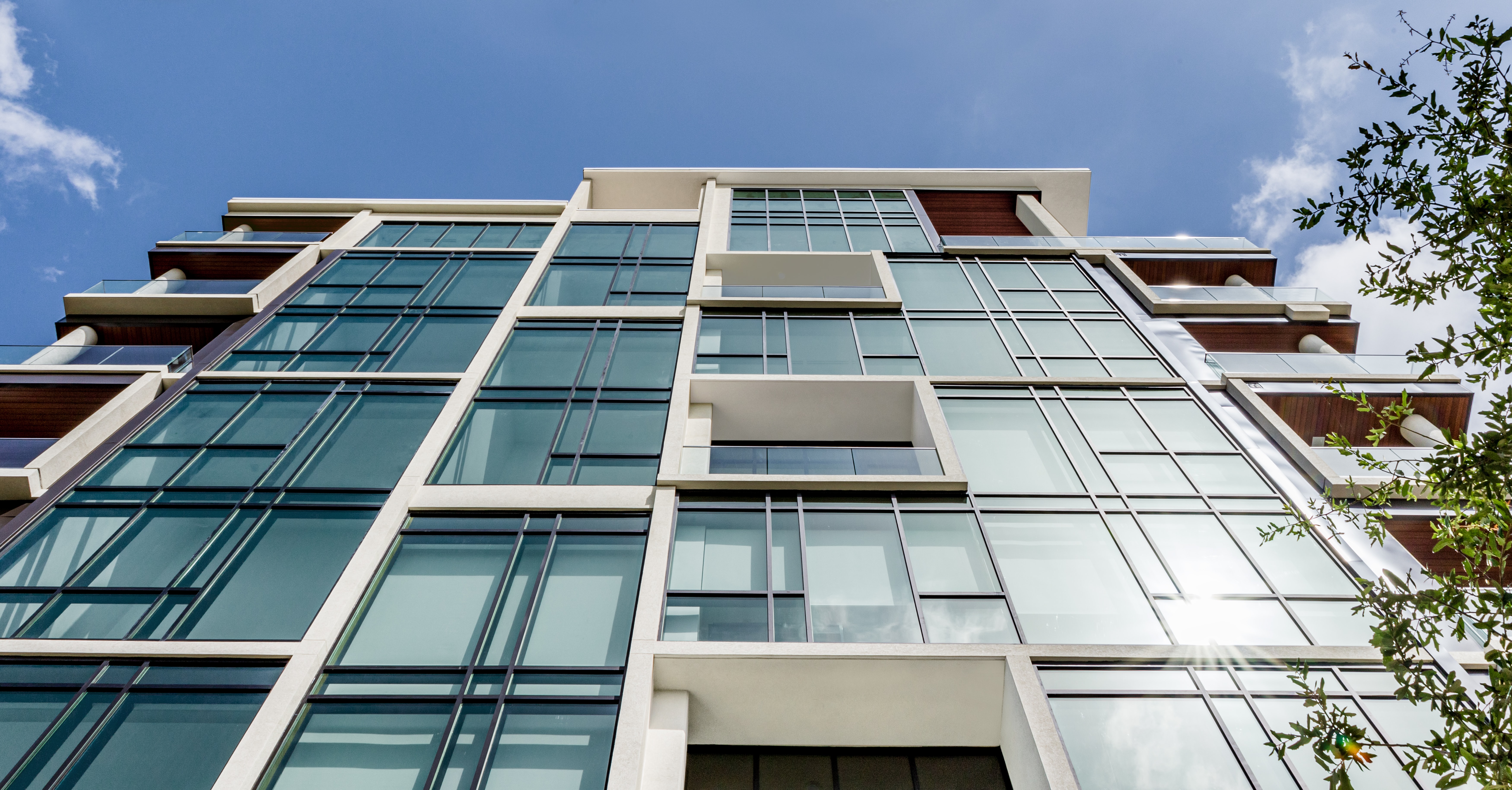 view of condo building looking straight up