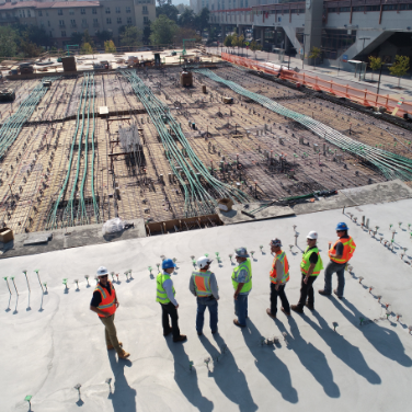 jobsite with workers in hard hats