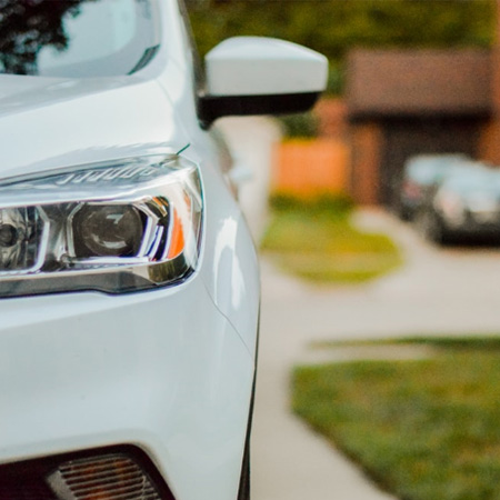 white car parked in a driveway